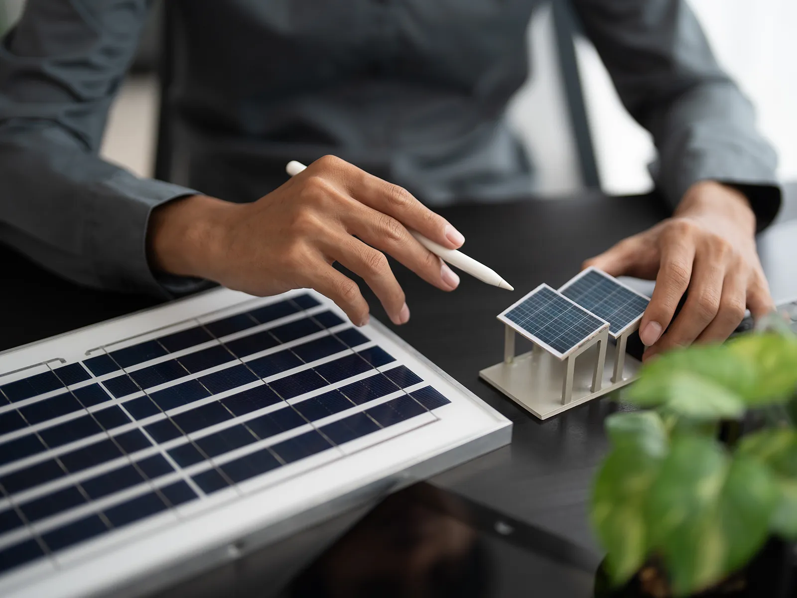 Man holding miniature solar panel