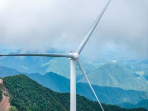 Windmill close up with mountains in the background